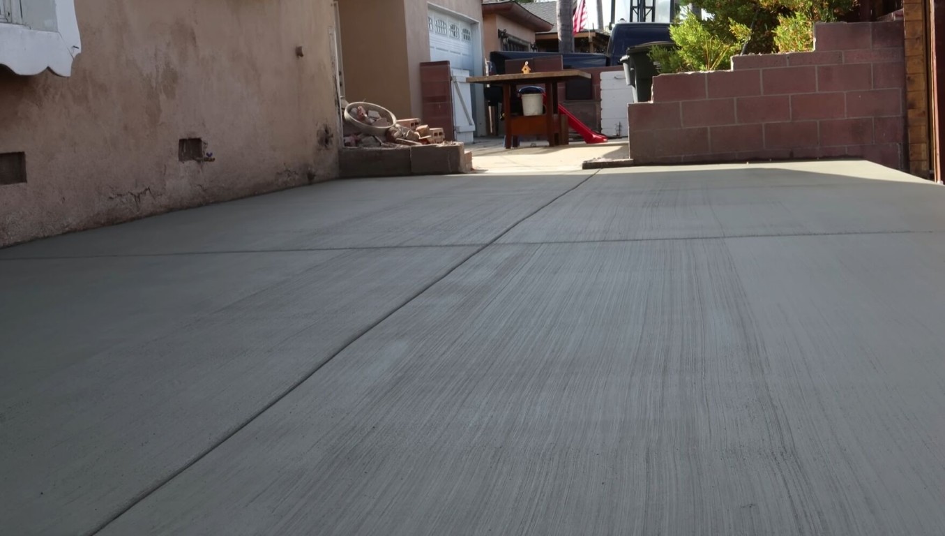 Smooth broom-finished concrete driveway installation in Calexico, CA